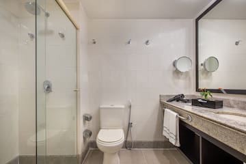 a bathroom with a shower and toilet