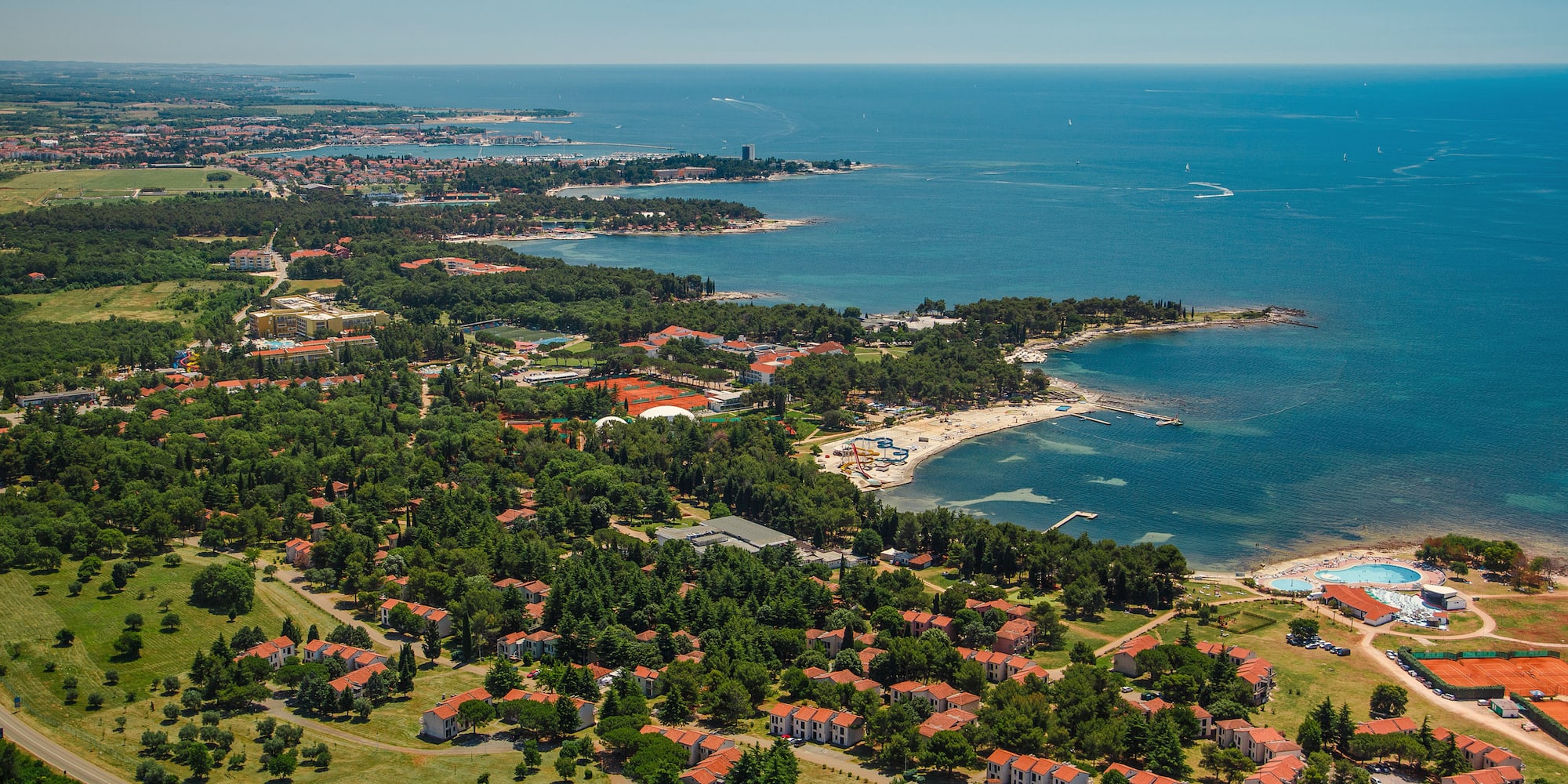 a aerial view of a town by the water