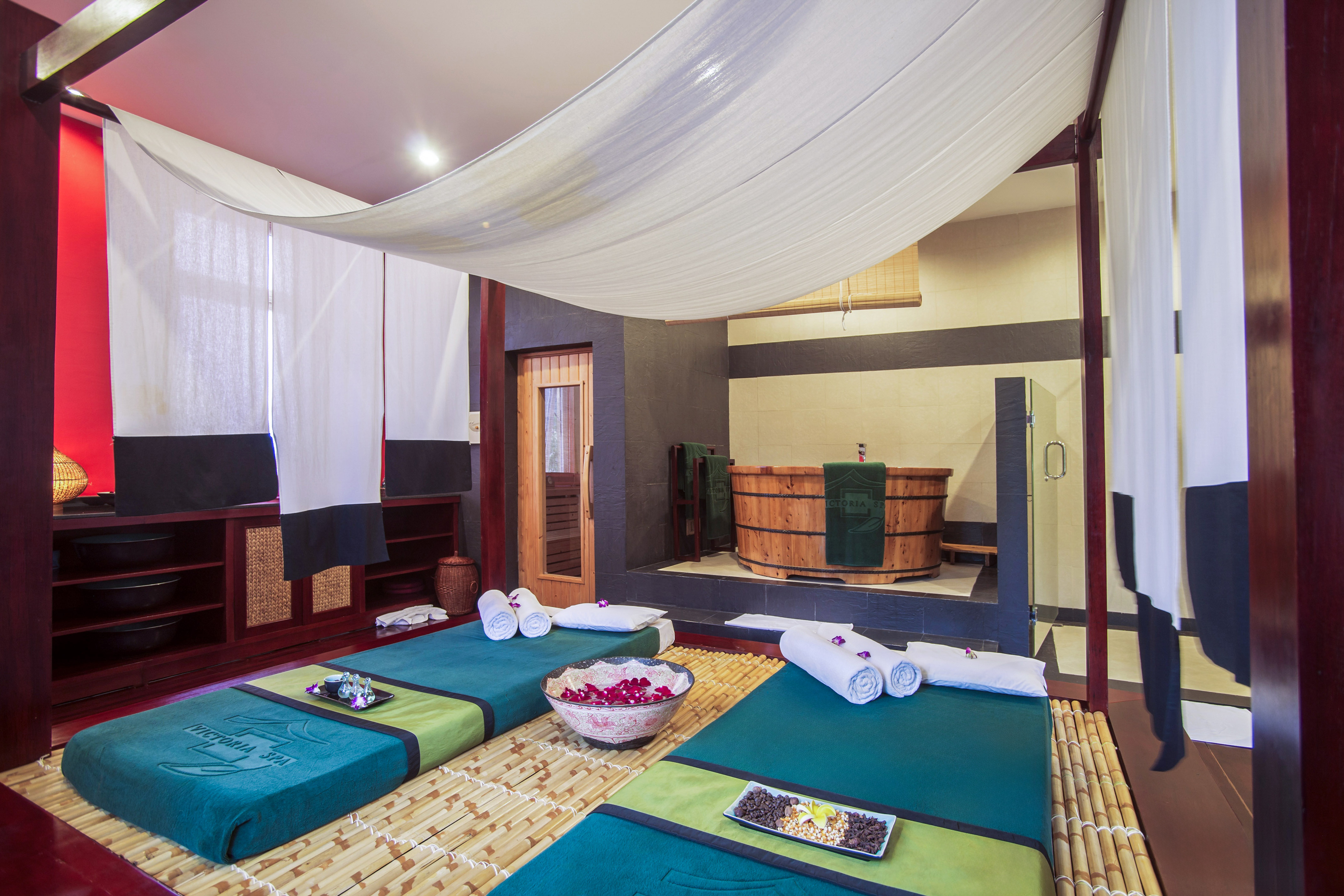 a room with a large bed and towels