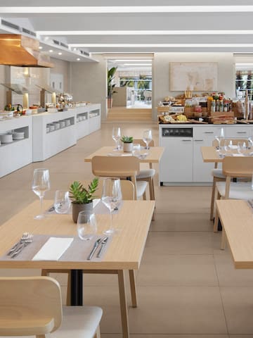 a restaurant with tables and chairs