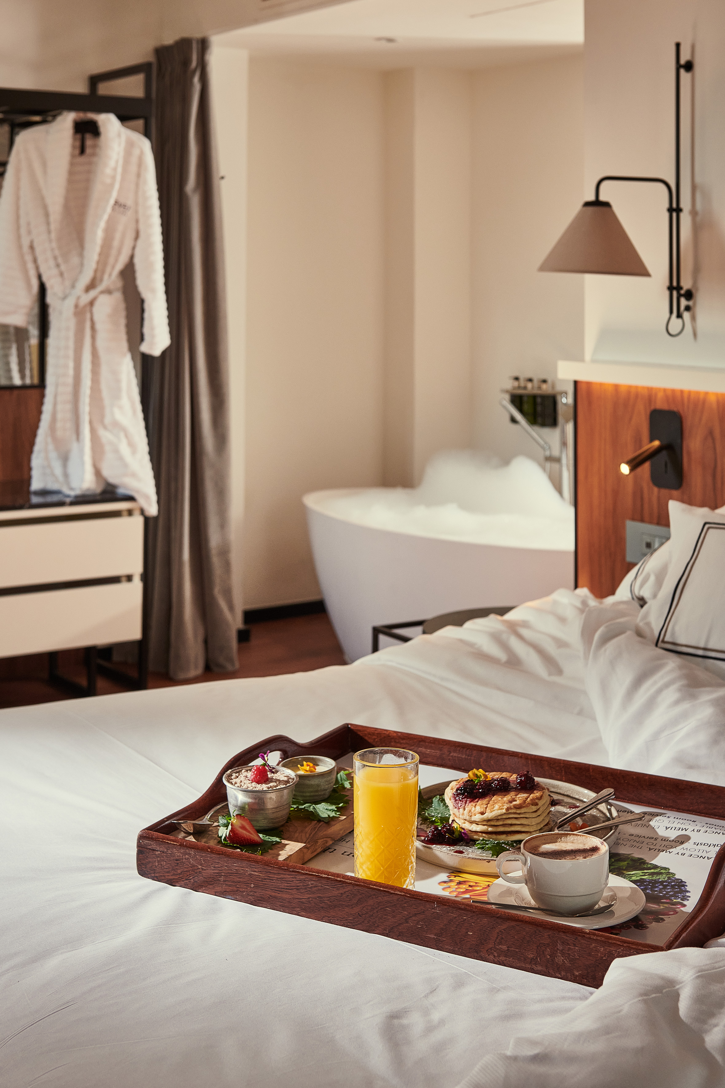 a tray of breakfast on a bed