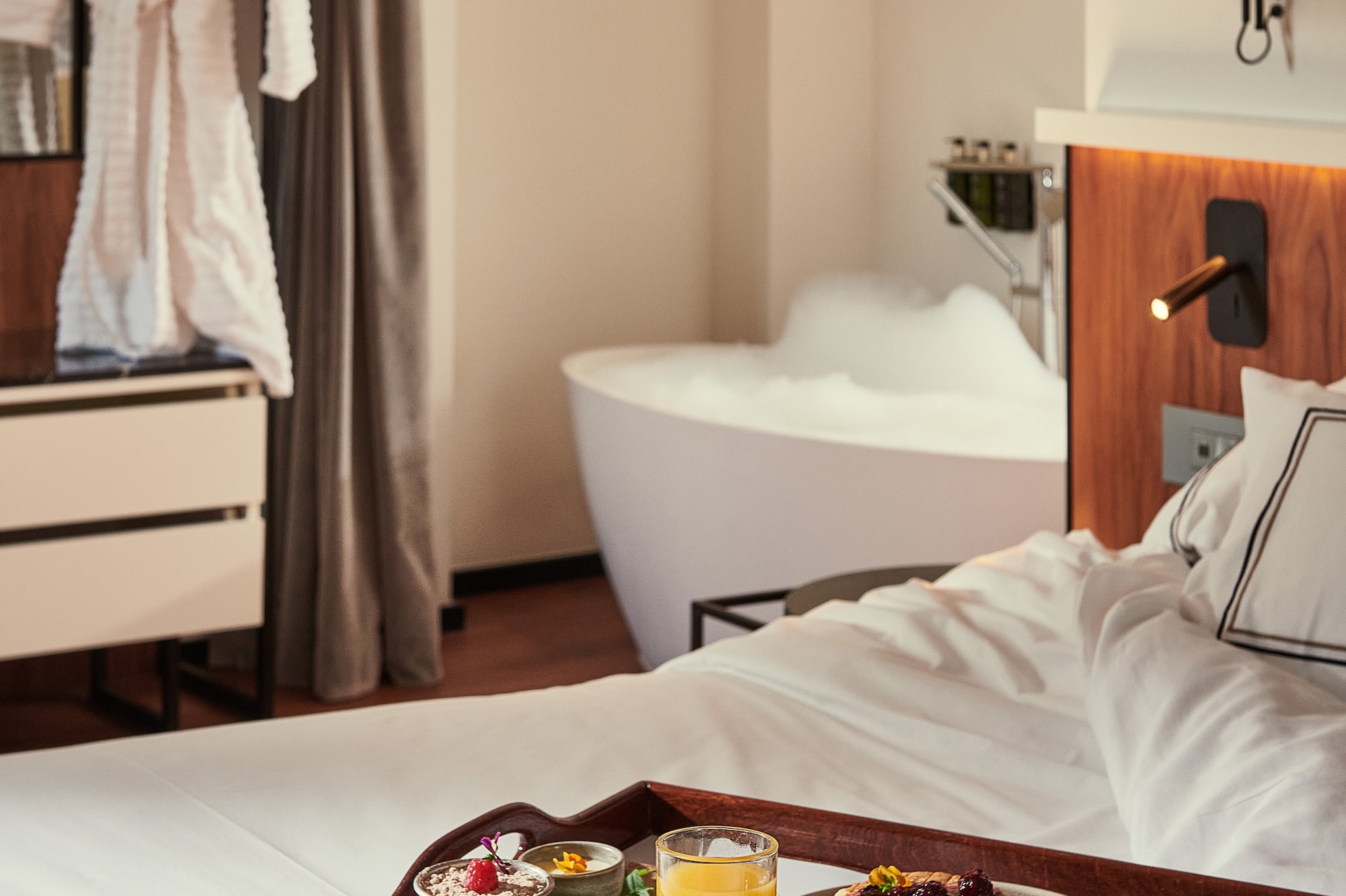 a tray of breakfast on a bed