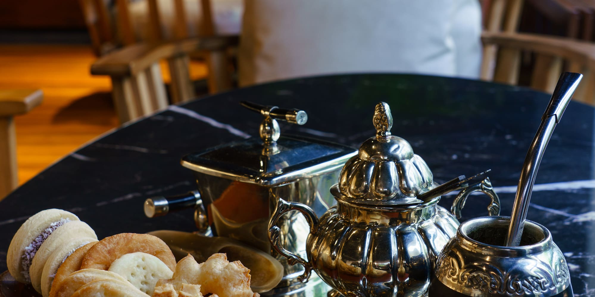 a tray of cookies and tea on a table