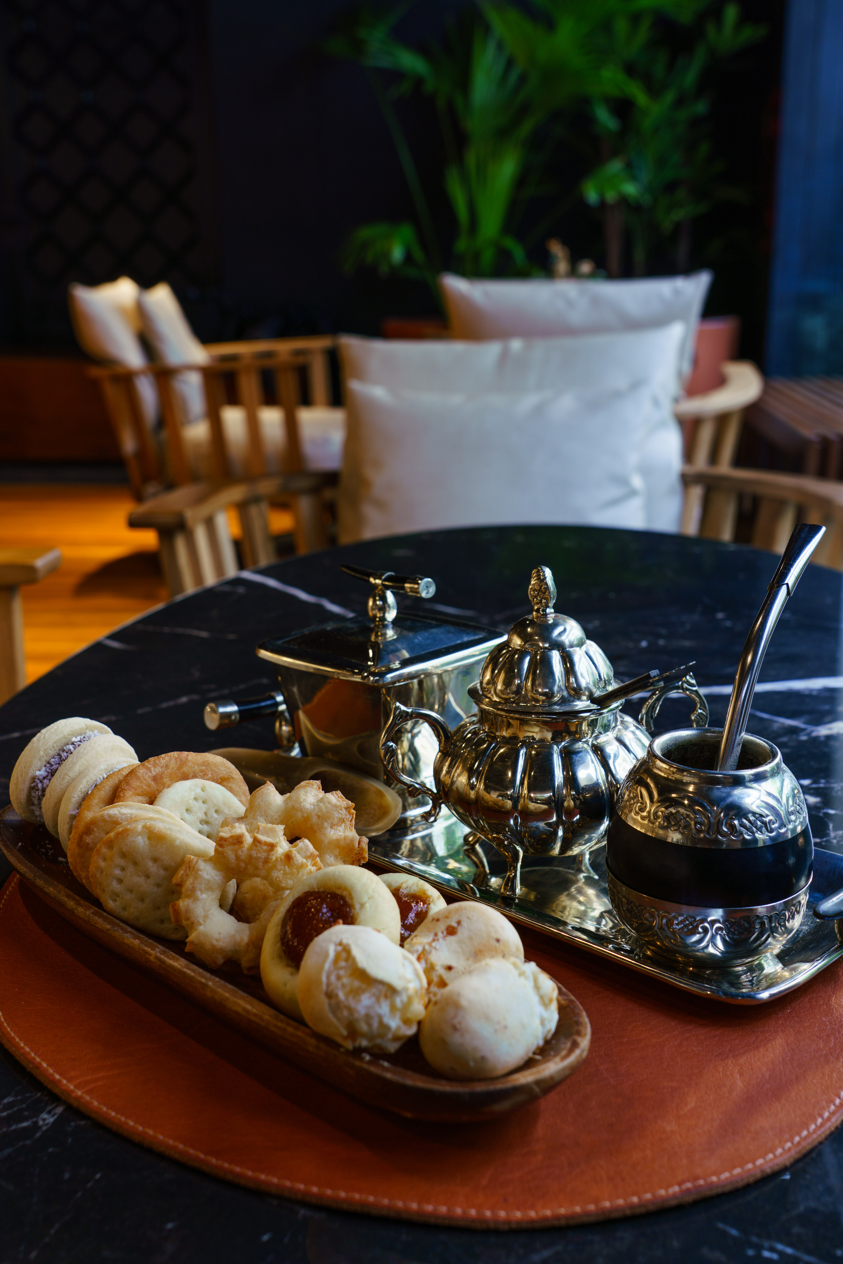 a tray of cookies and tea on a table