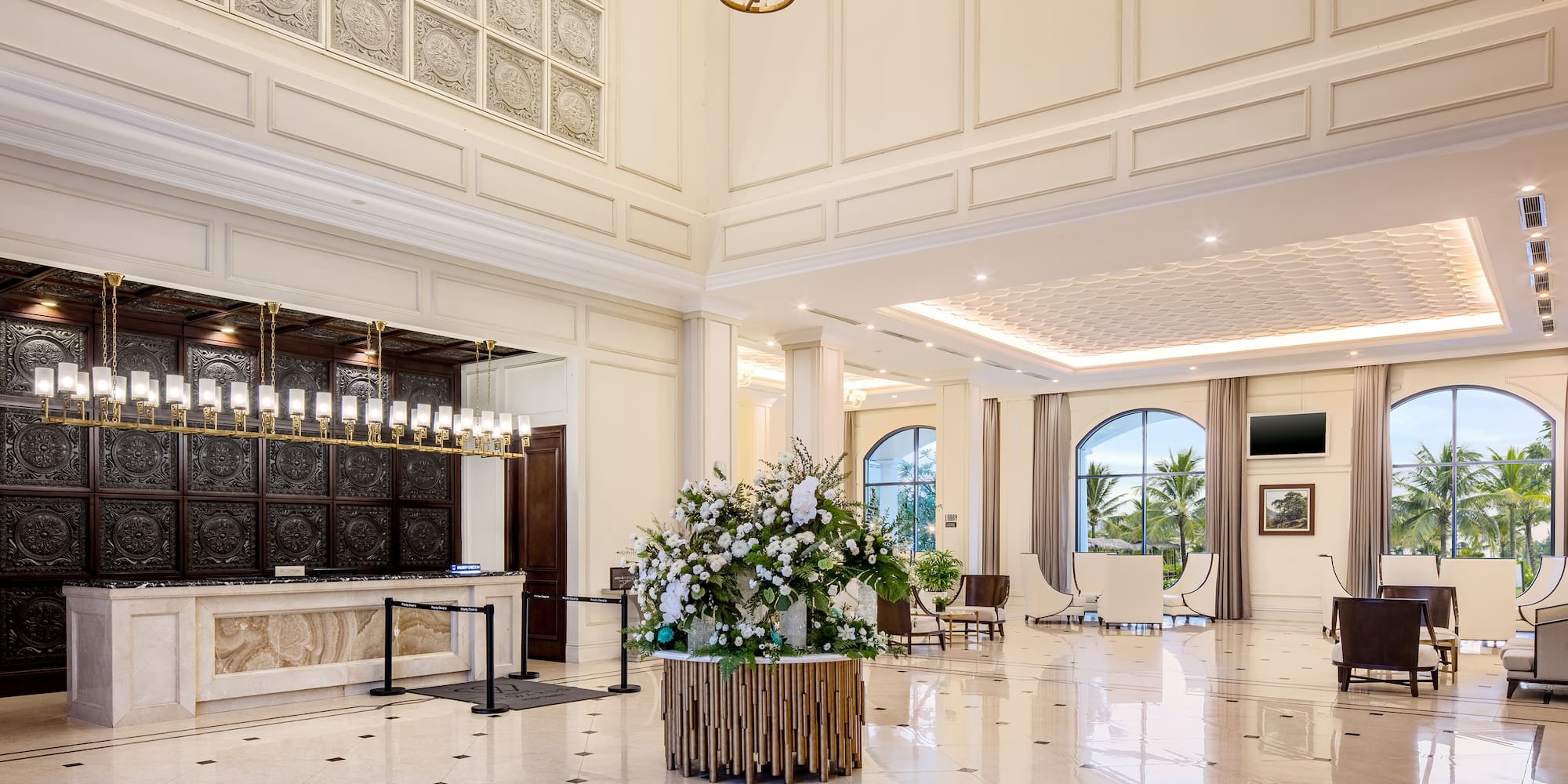 a large white room with a large table and chairs