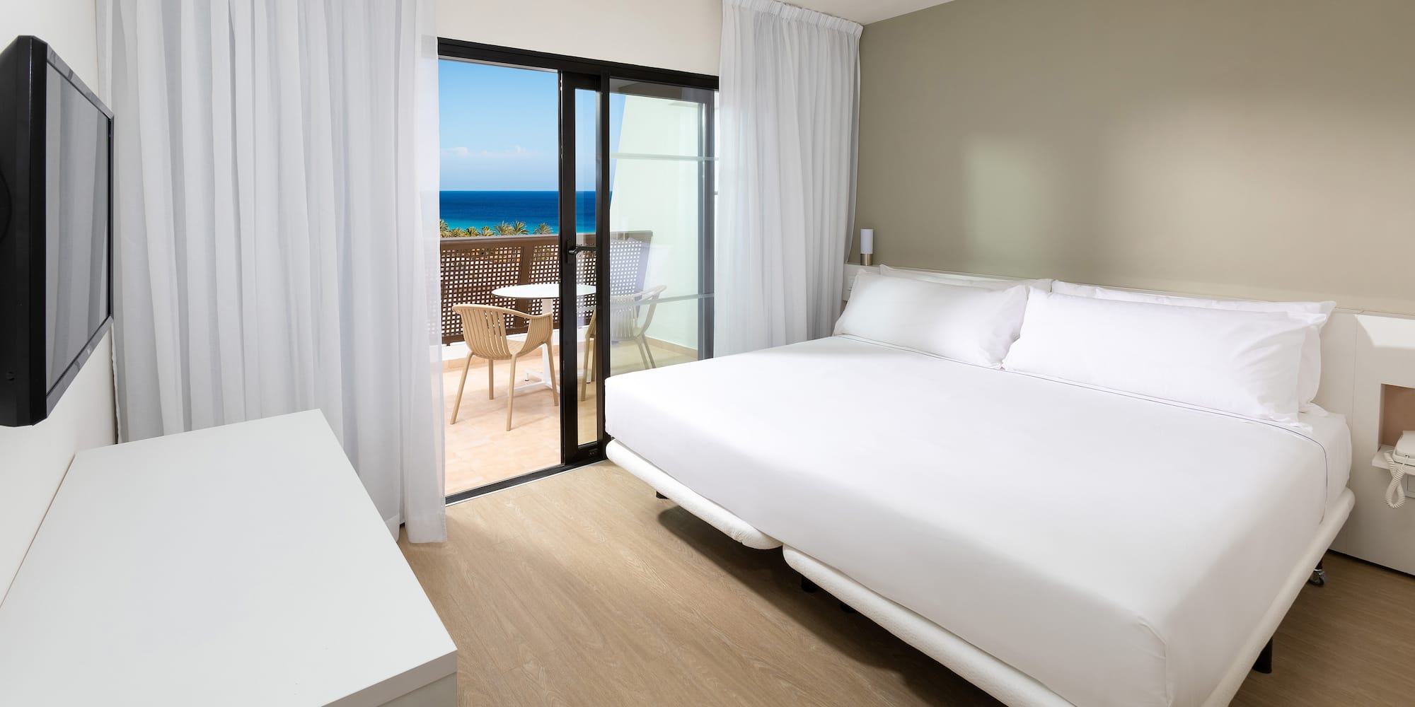 a room with a bed and a glass door