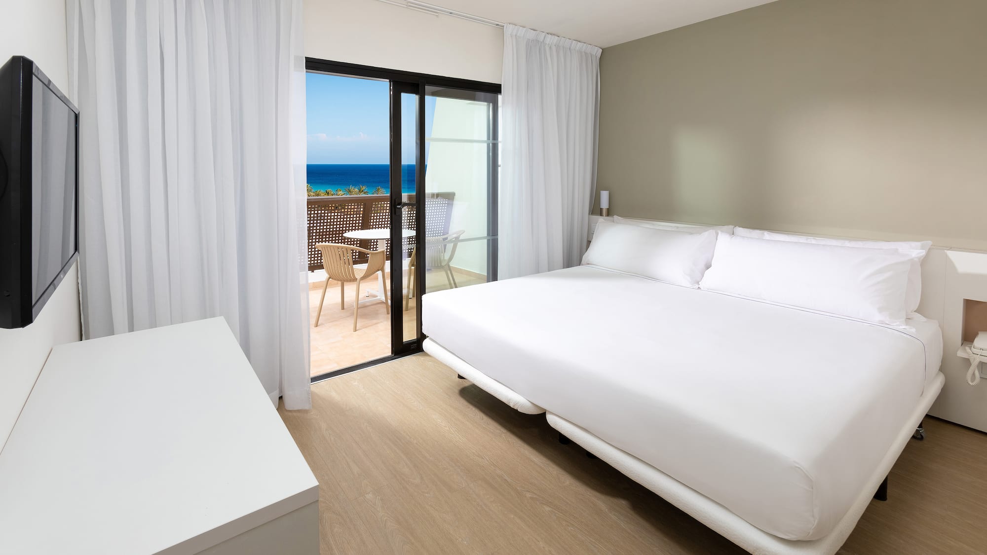 a room with a bed and a glass door