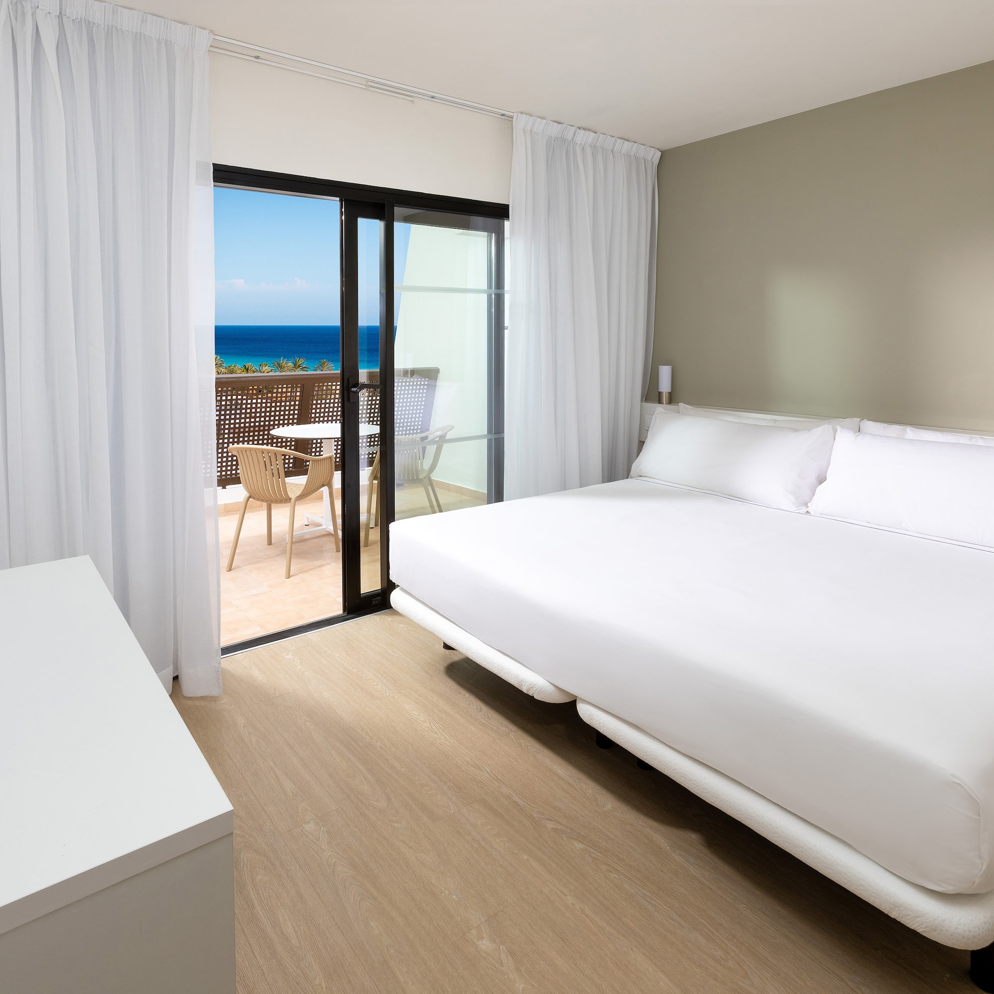 a room with a bed and a glass door