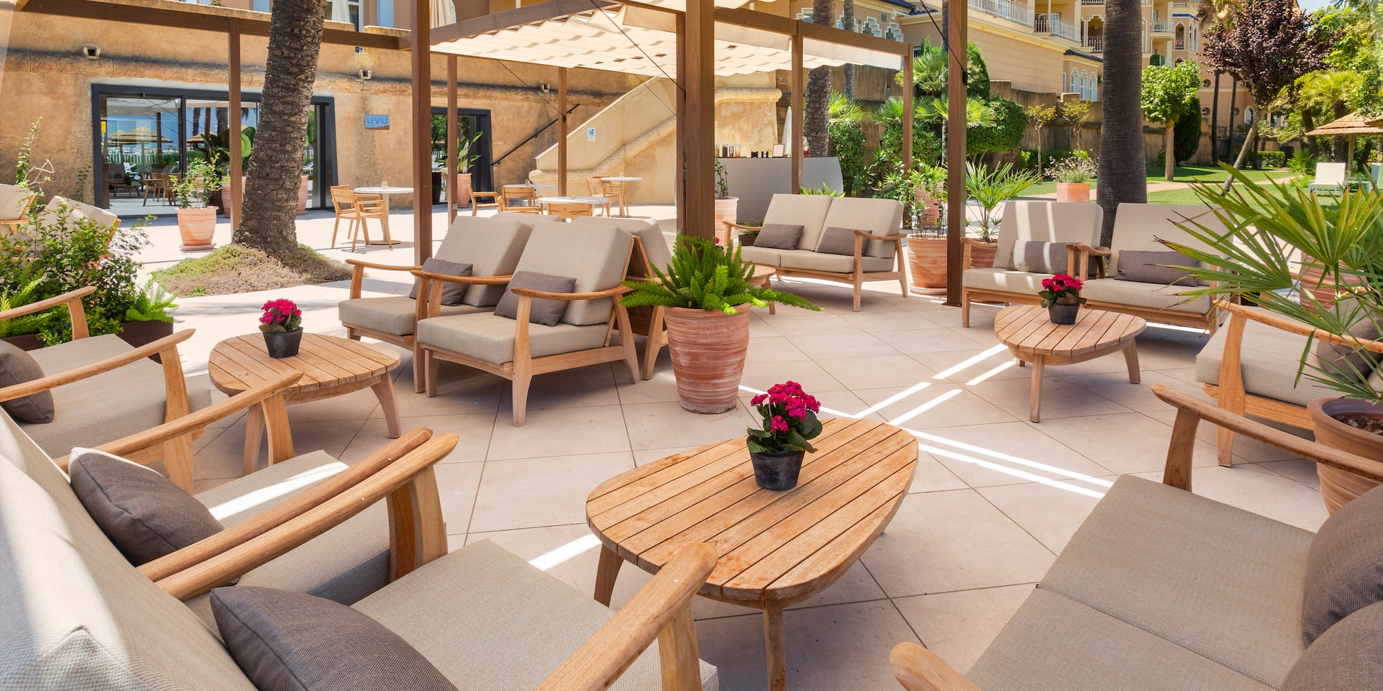 a patio with chairs and tables