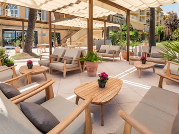 a patio with chairs and tables
