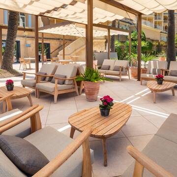 a patio with chairs and tables