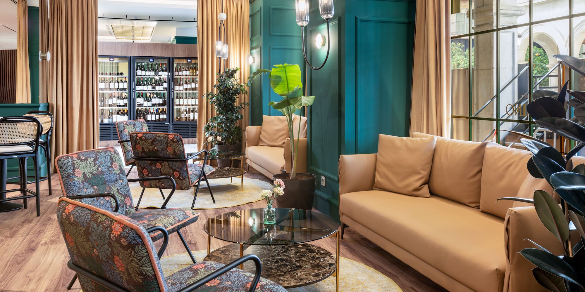 a room with a couch and chairs