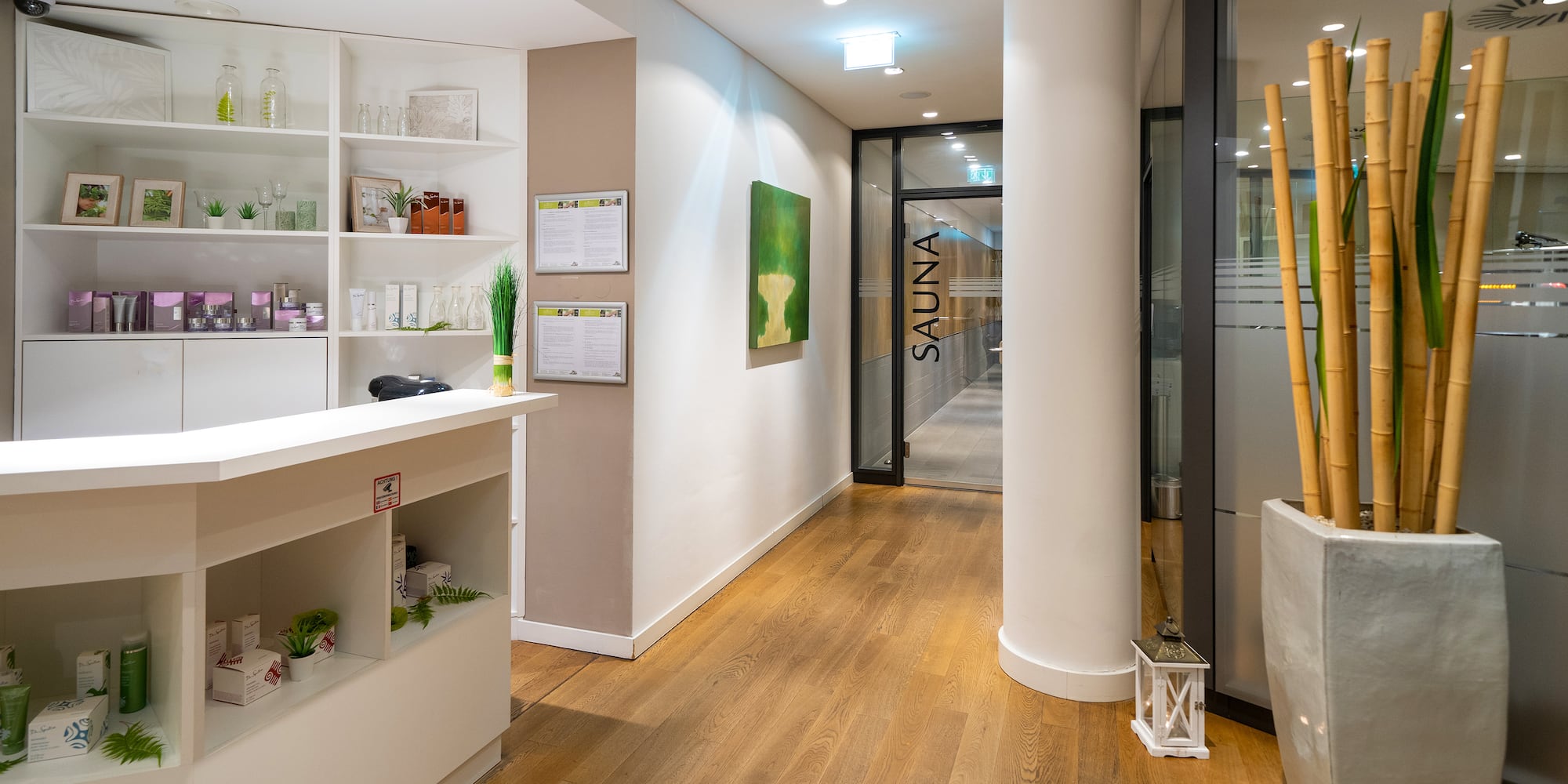 a room with a reception desk and a wood floor