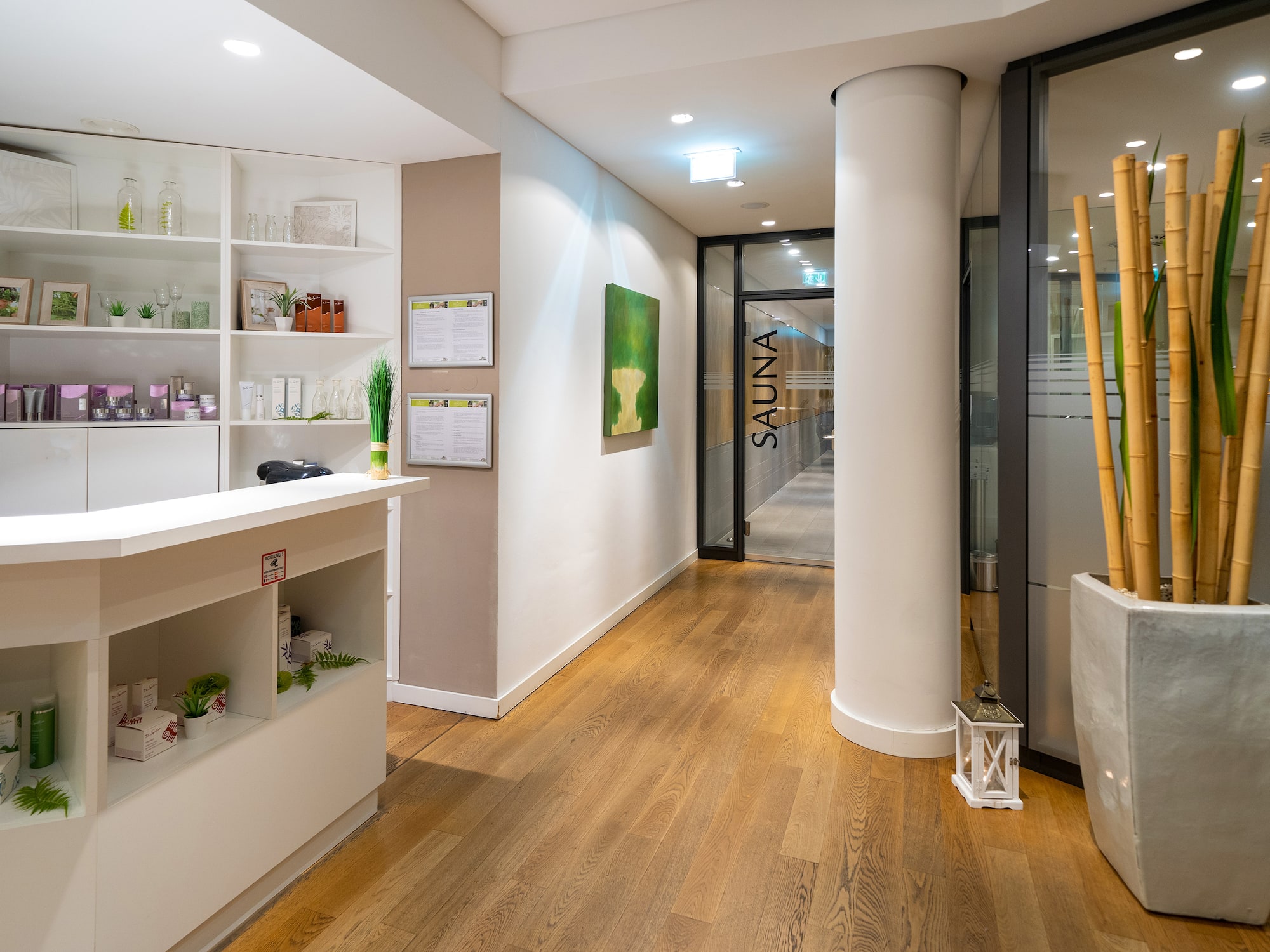 a room with a reception desk and a wood floor