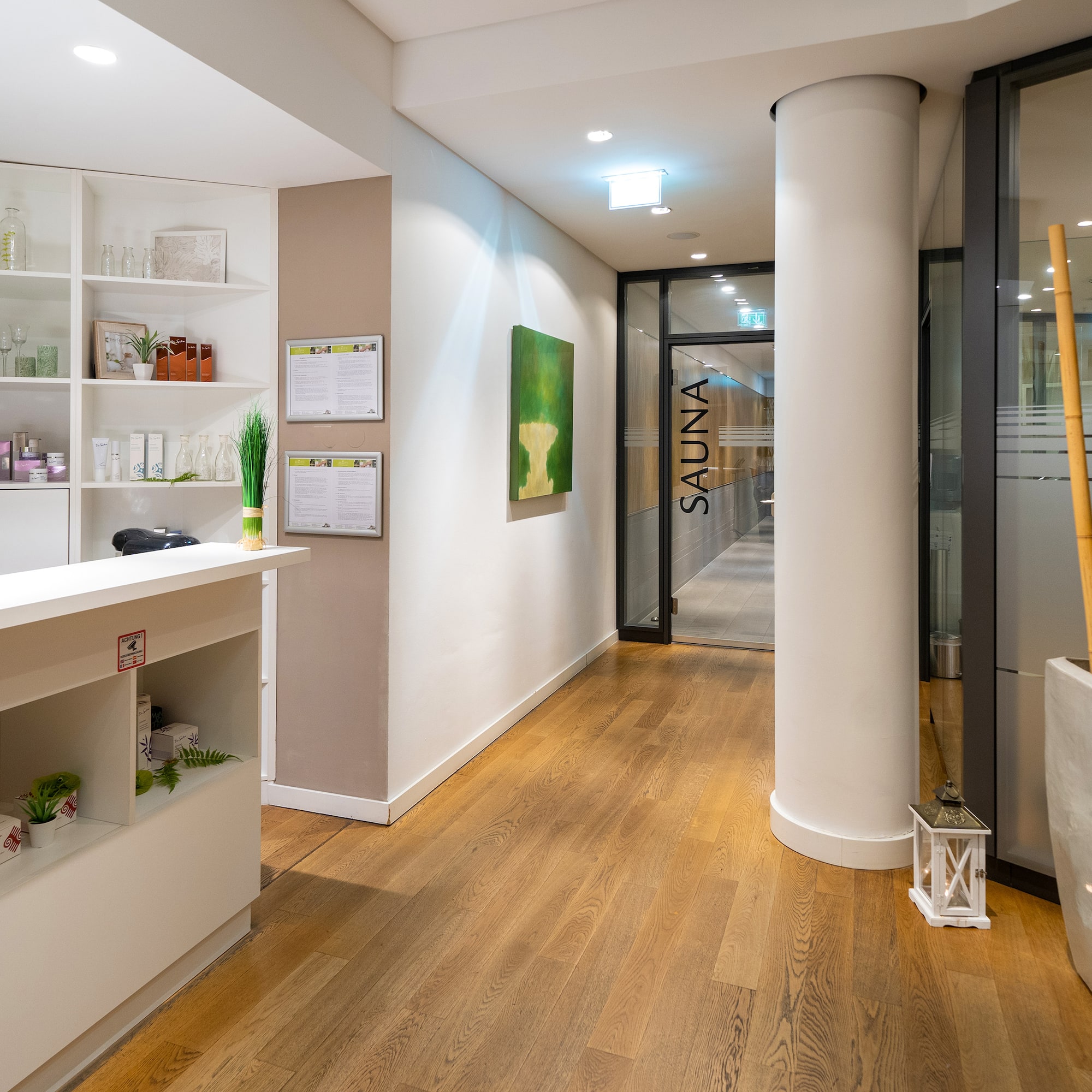 a room with a reception desk and a wood floor