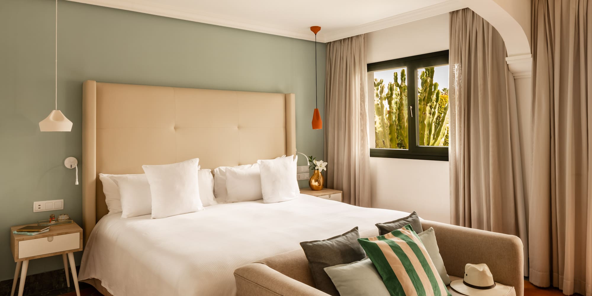 a bed with pillows in a room