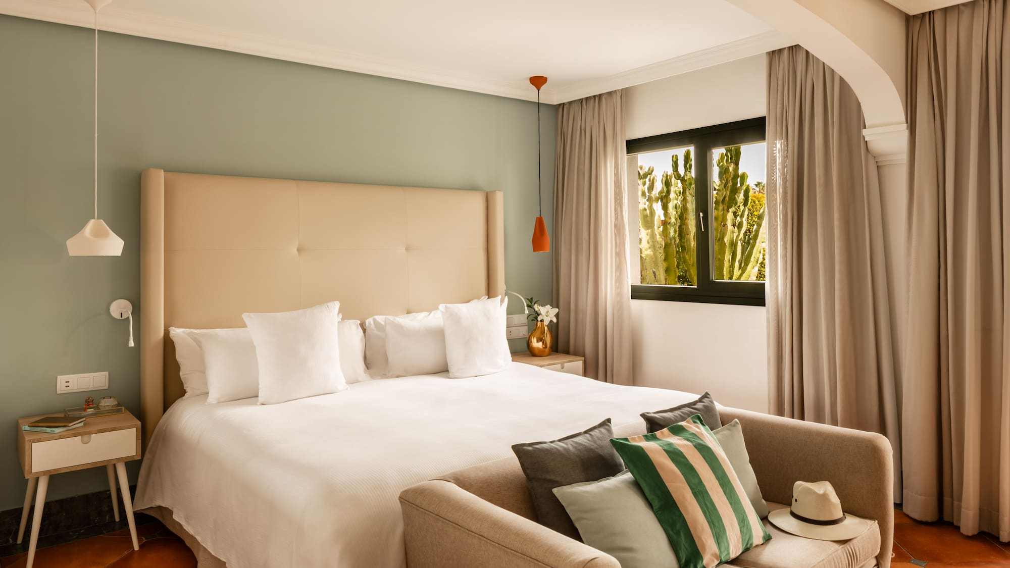 a bed with pillows in a room