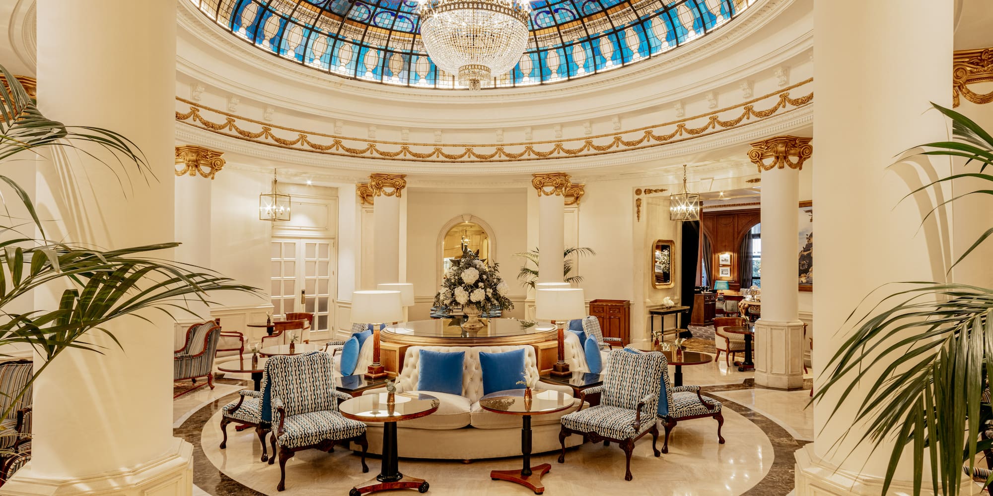 a room with a glass ceiling and a chandelier