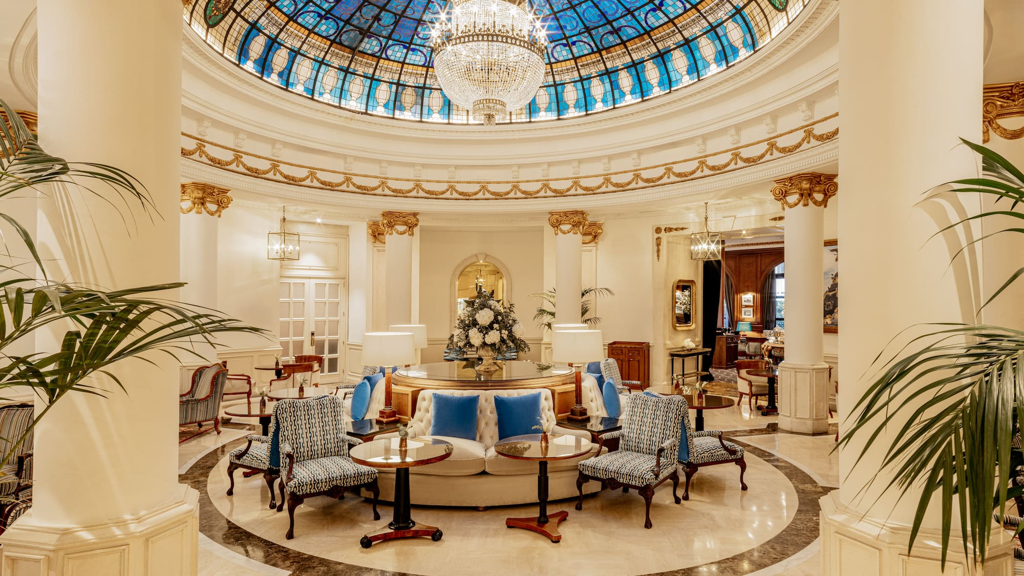 a room with a glass ceiling and a chandelier