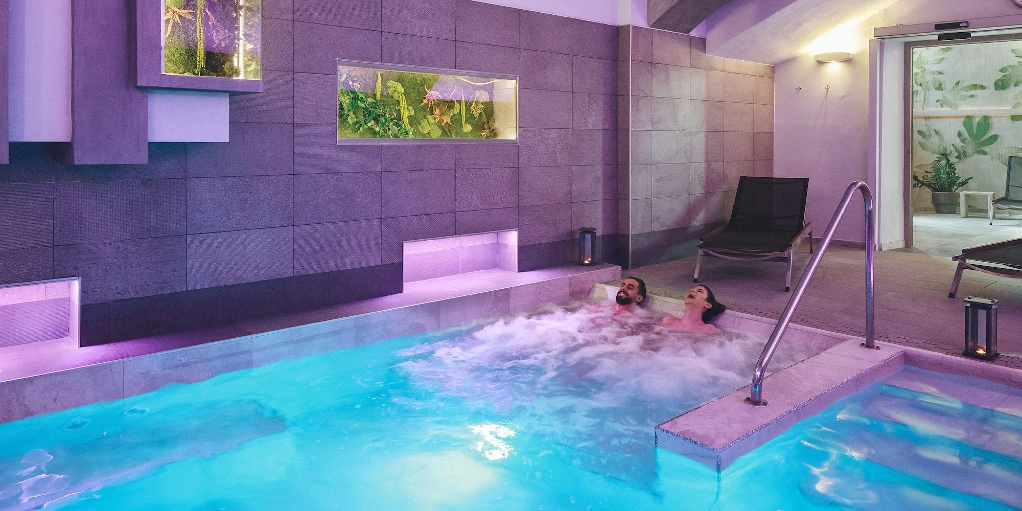 a couple of people in a hot tub