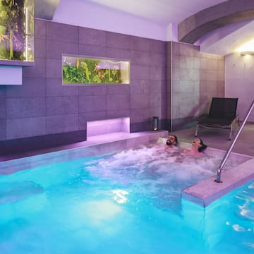 a couple of people in a hot tub