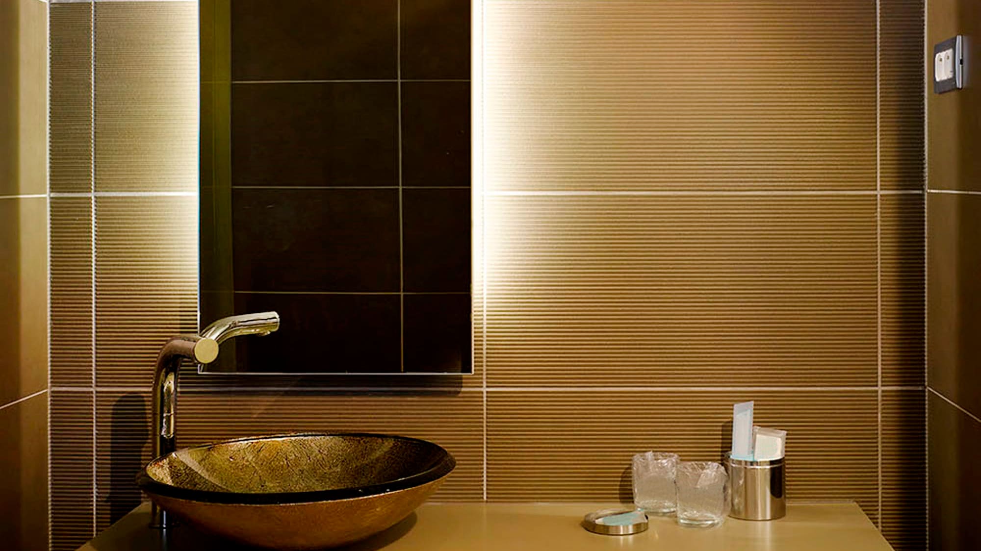 a bathroom with a sink and mirror