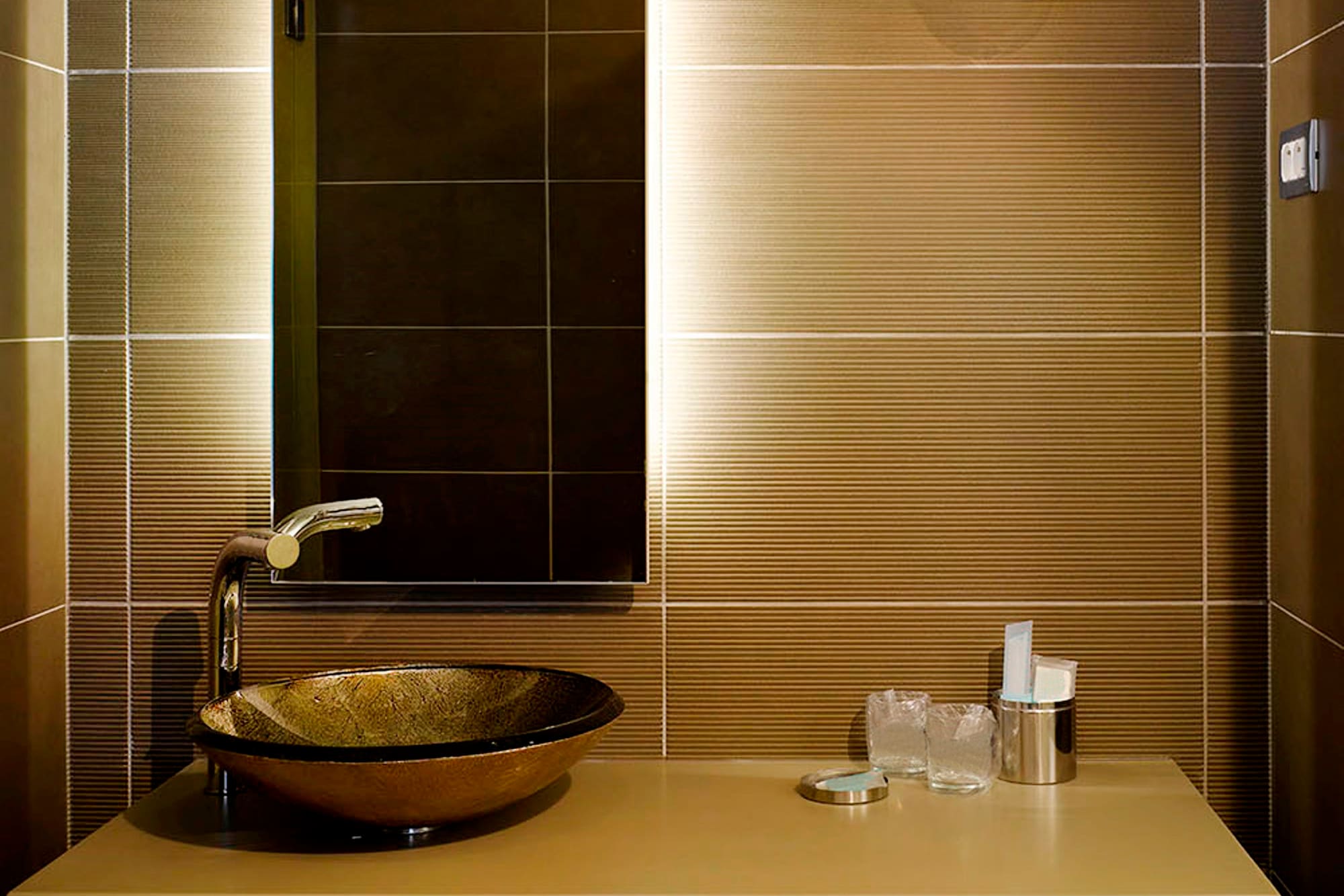 a bathroom with a sink and mirror