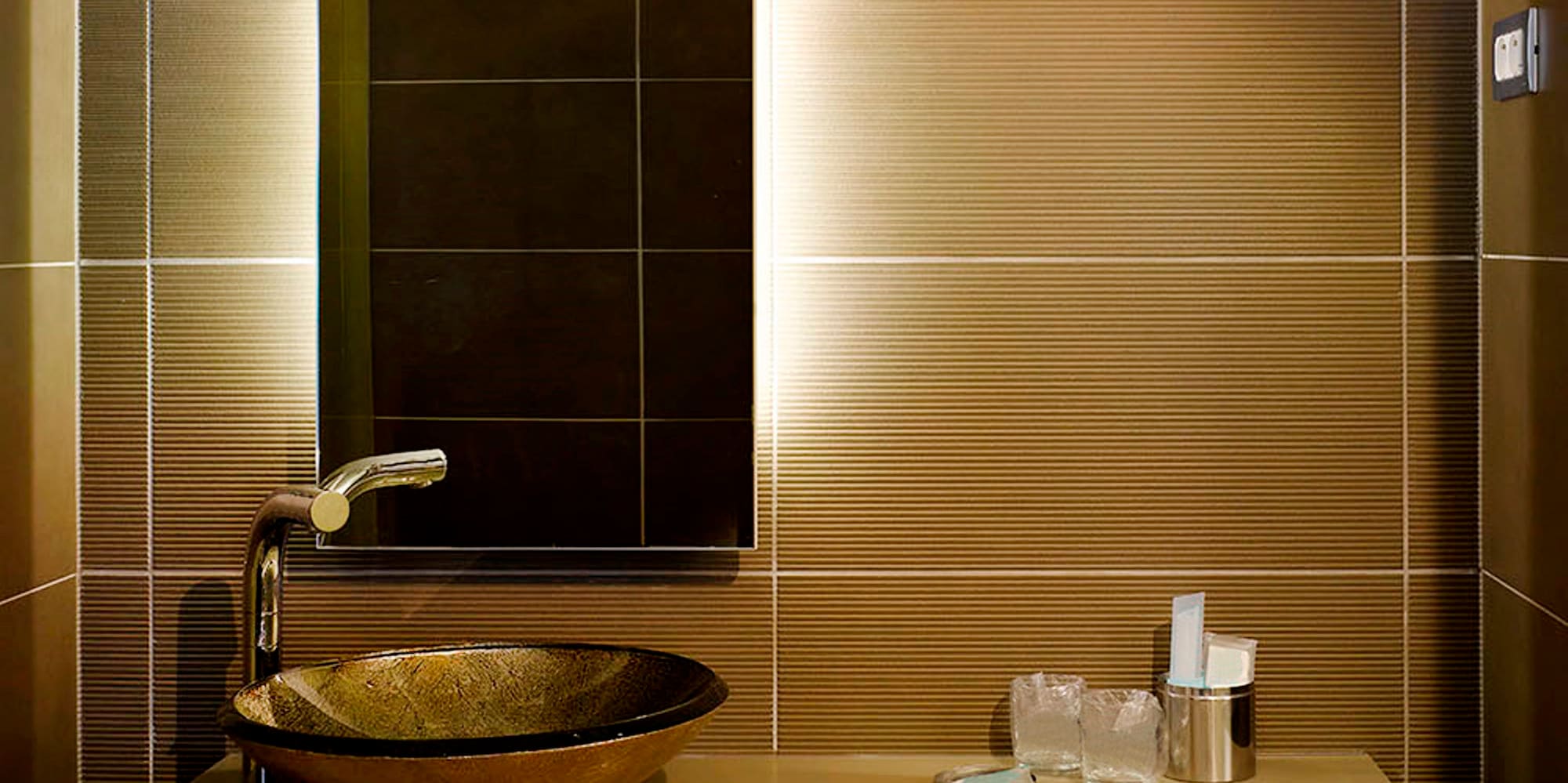 a bathroom with a sink and mirror