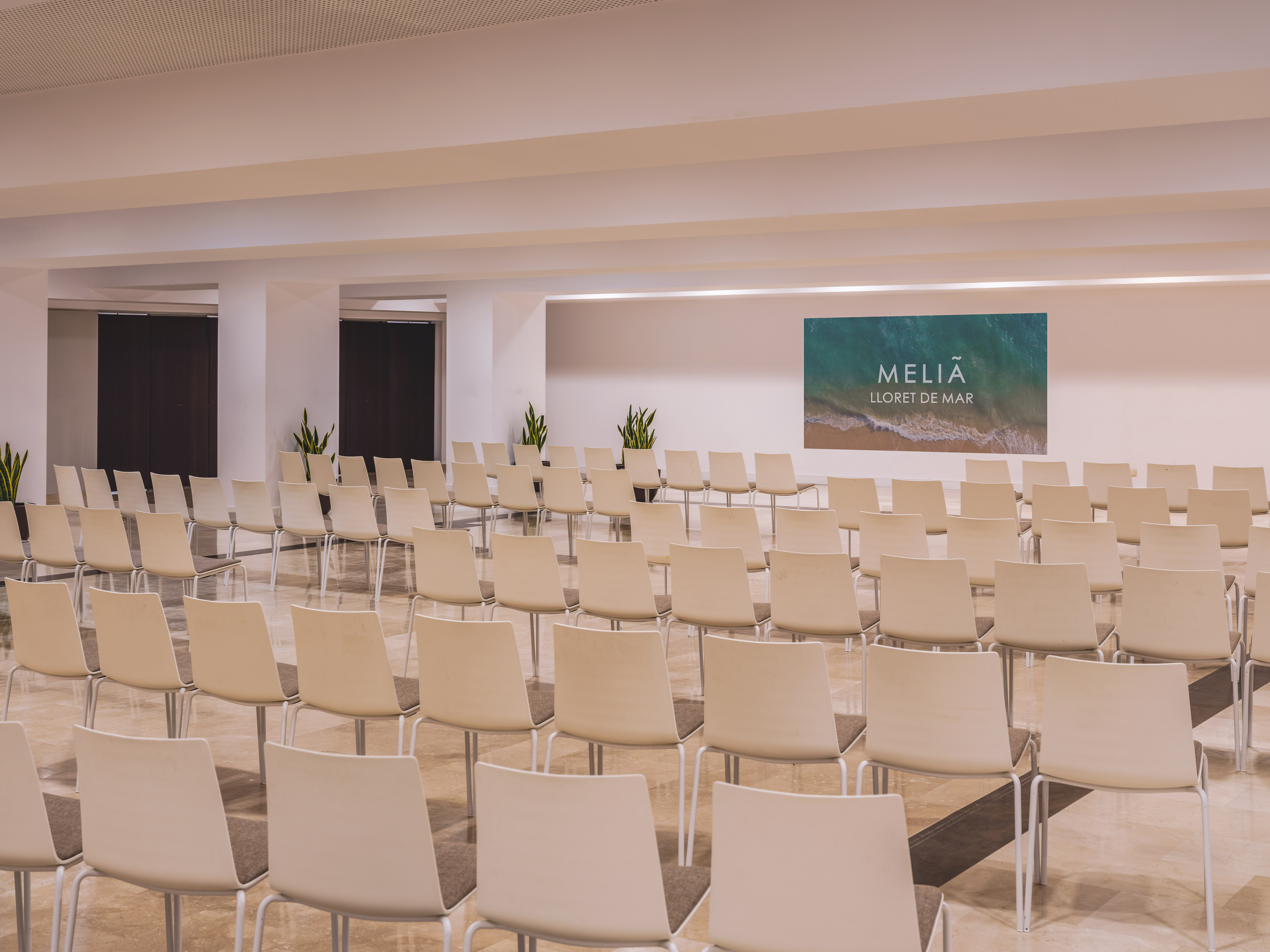 Modern Meliã Lloret de Mar event room with arranged seating for conferences.