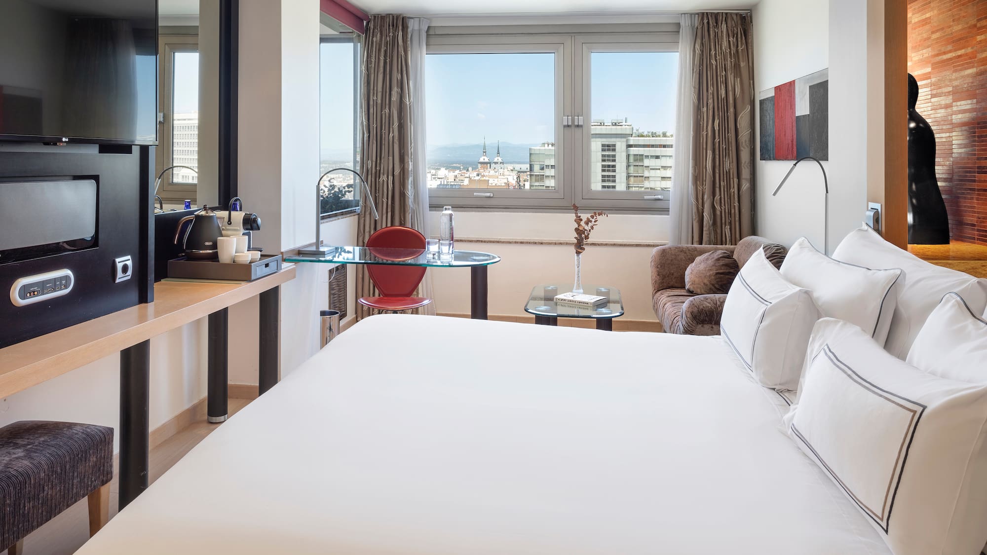 a room with a bed and a desk