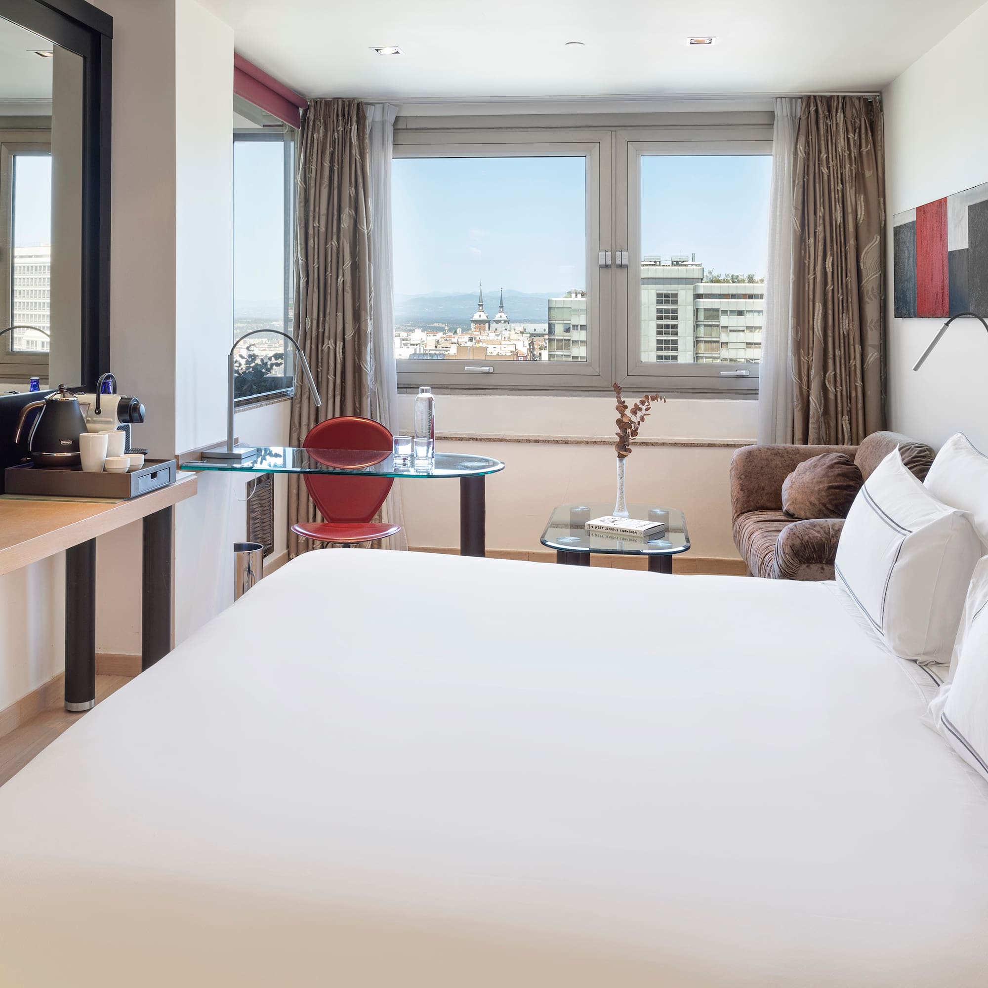 a room with a bed and a desk