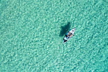a person in a kayak in the water