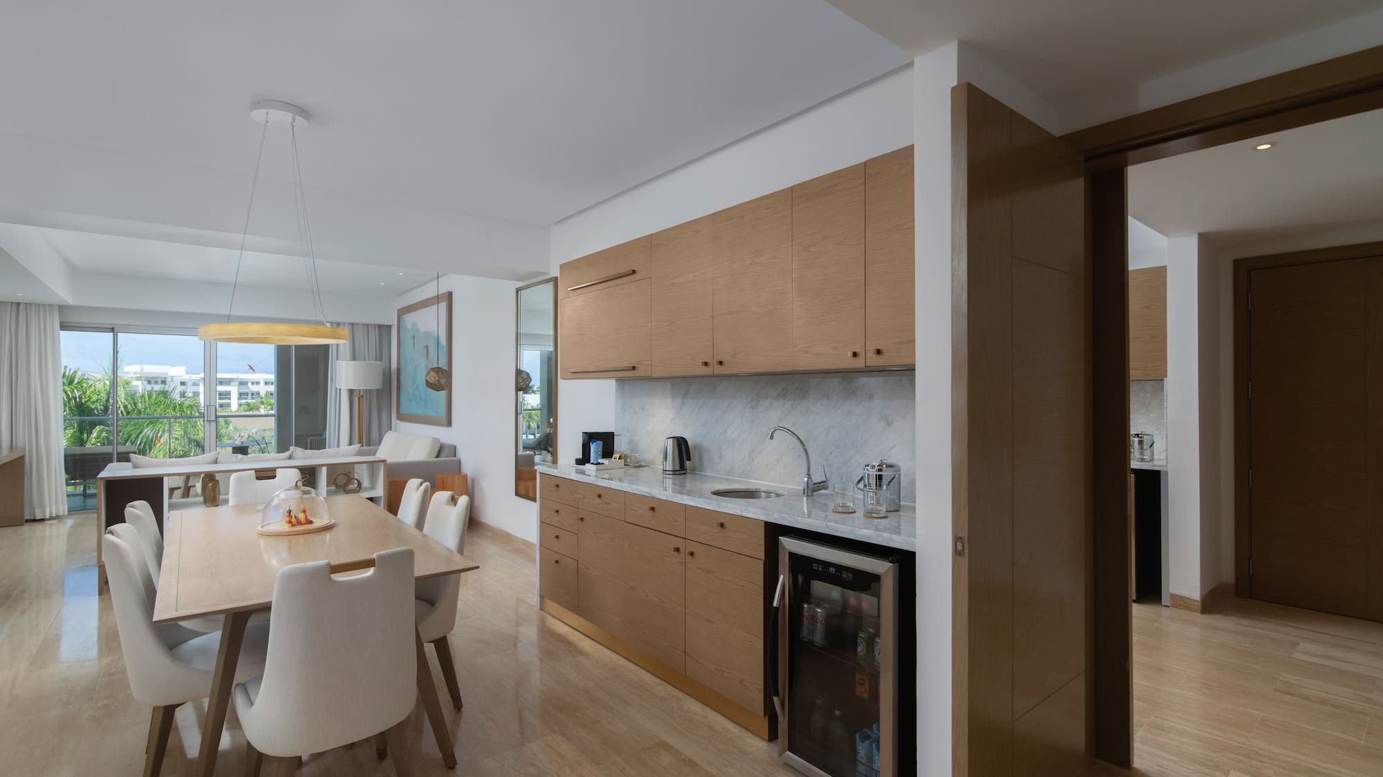 a kitchen and dining area with a table and chairs