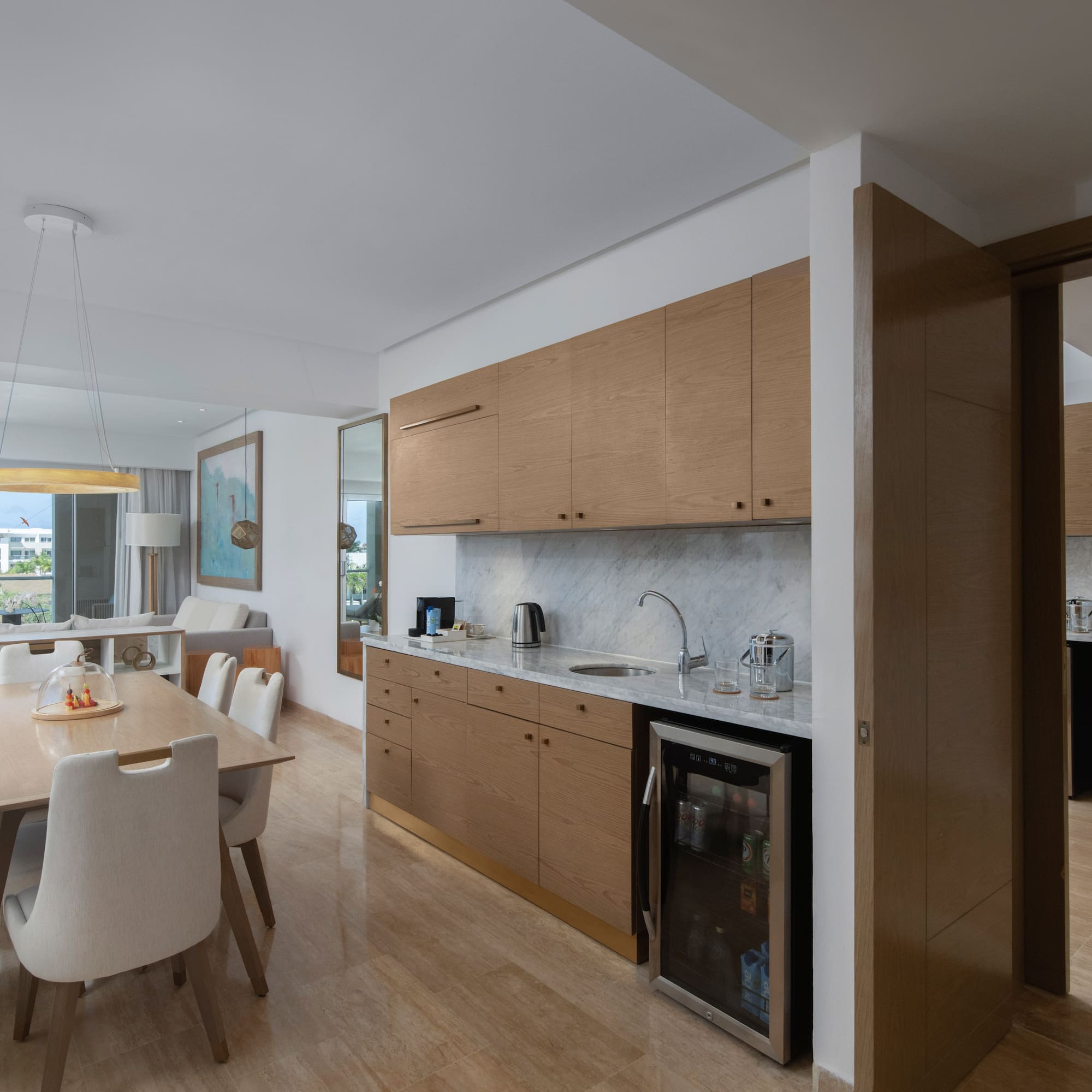 a kitchen and dining area with a table and chairs