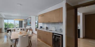 a kitchen and dining area with a table and chairs