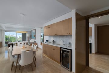 a kitchen and dining area with a table and chairs