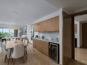 a kitchen and dining area with a table and chairs