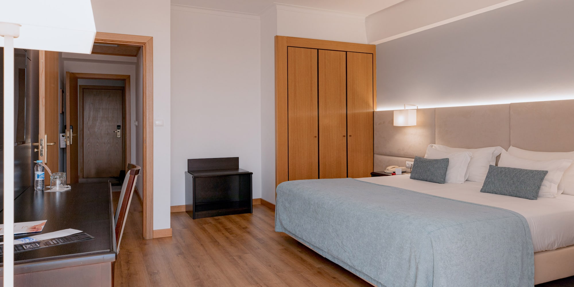 a bedroom with a bed and closets