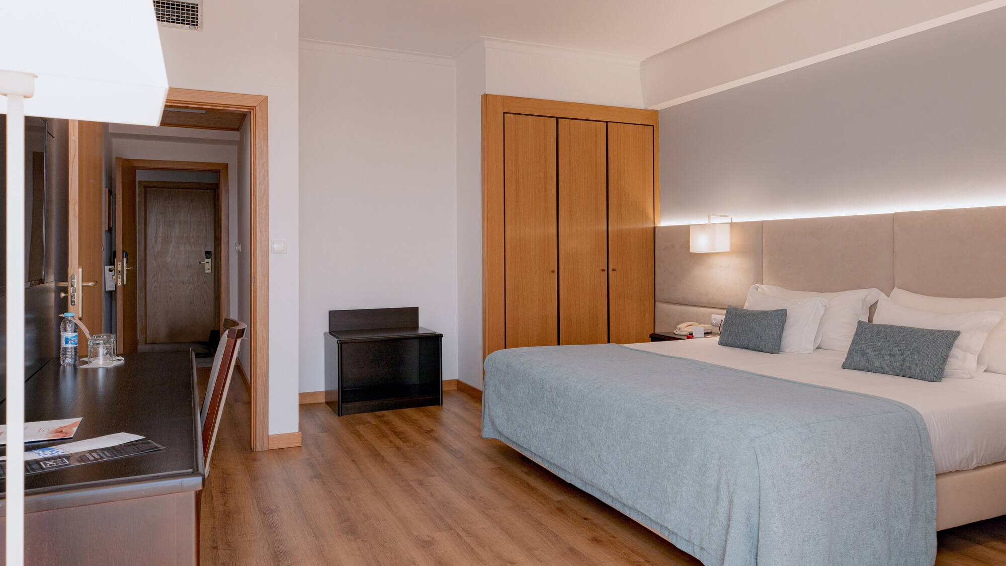 a bedroom with a bed and closets