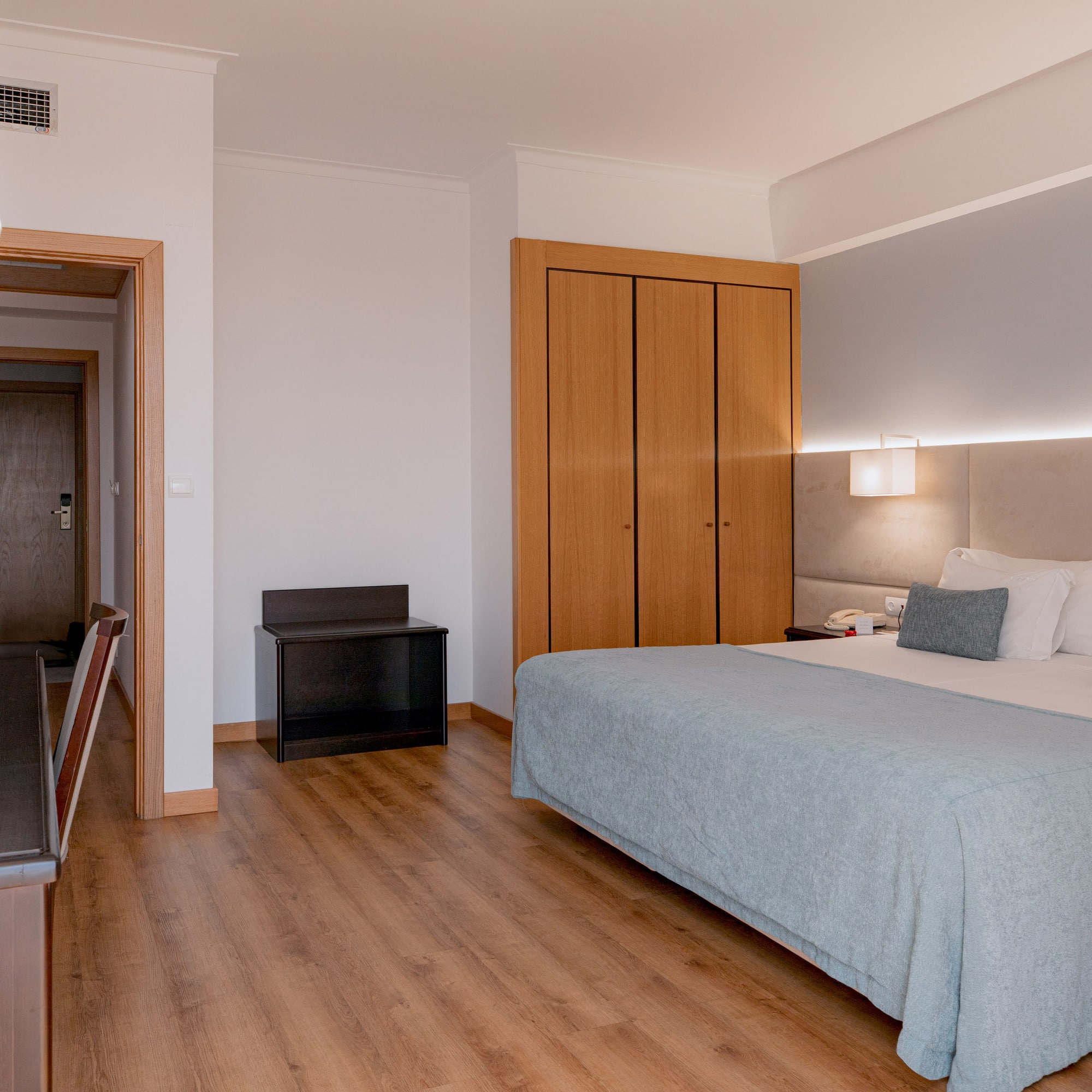 a bedroom with a bed and closets