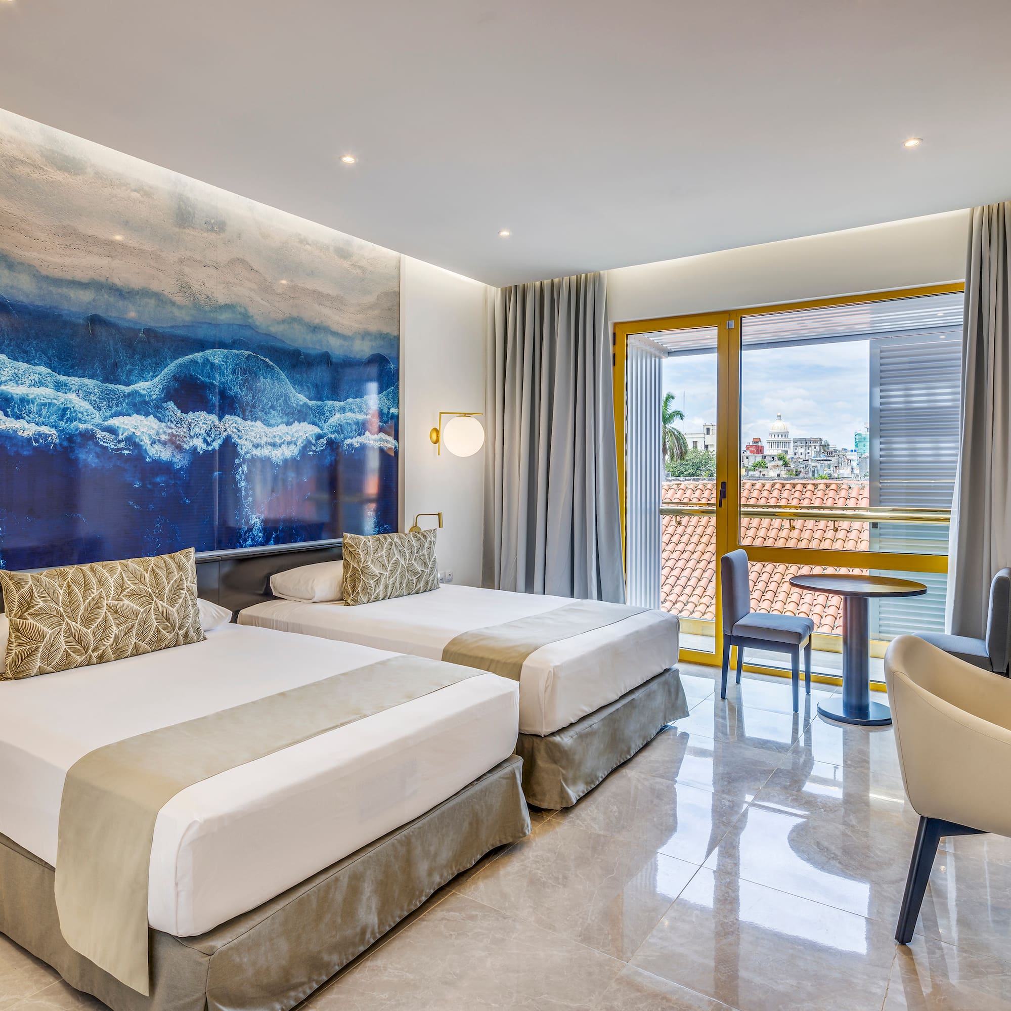 a room with two beds and a table