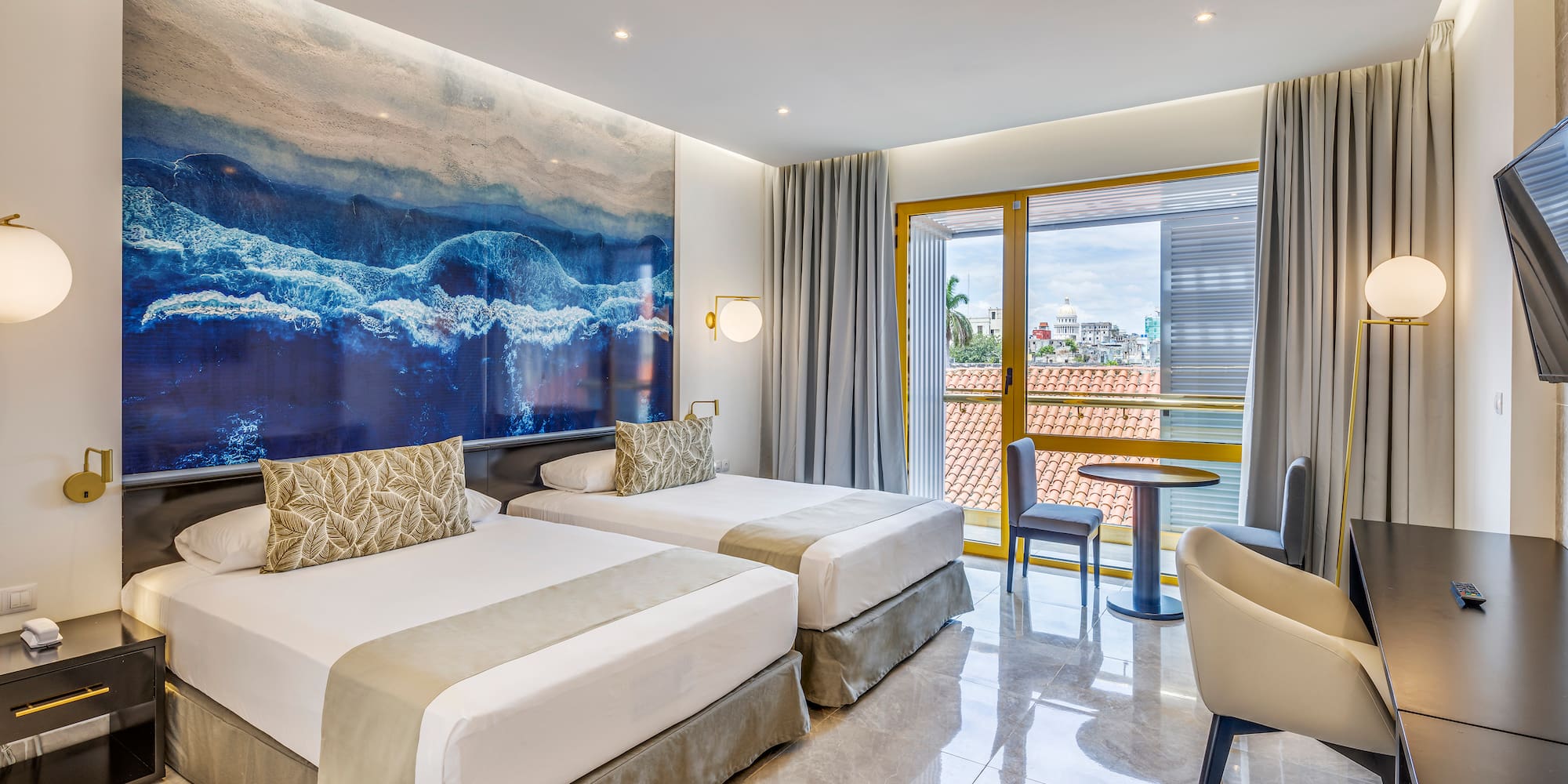 a room with two beds and a table