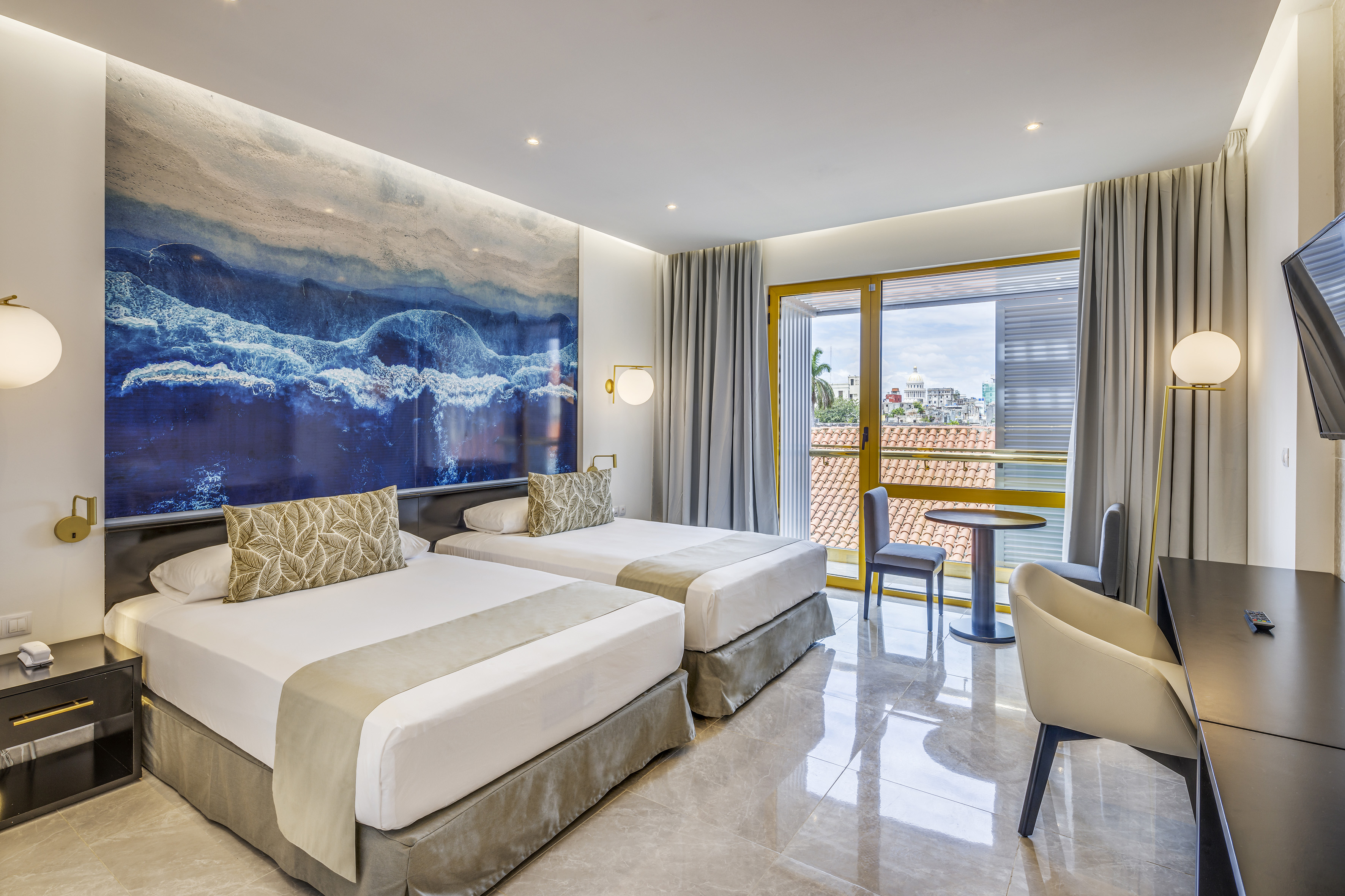 a room with two beds and a table