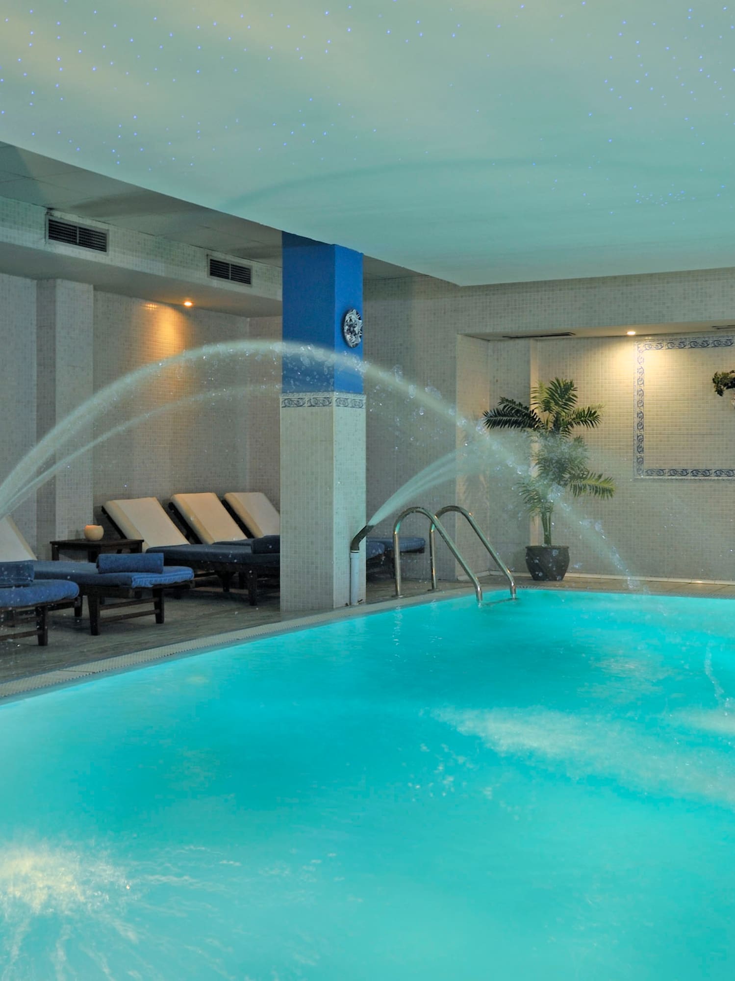 a swimming pool with water spraying into it