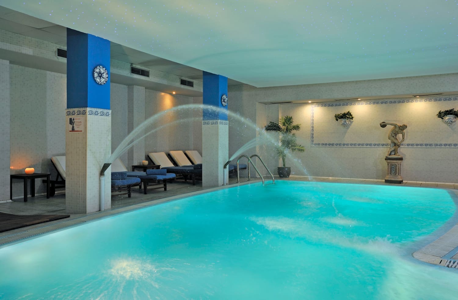 a swimming pool with water spraying into it