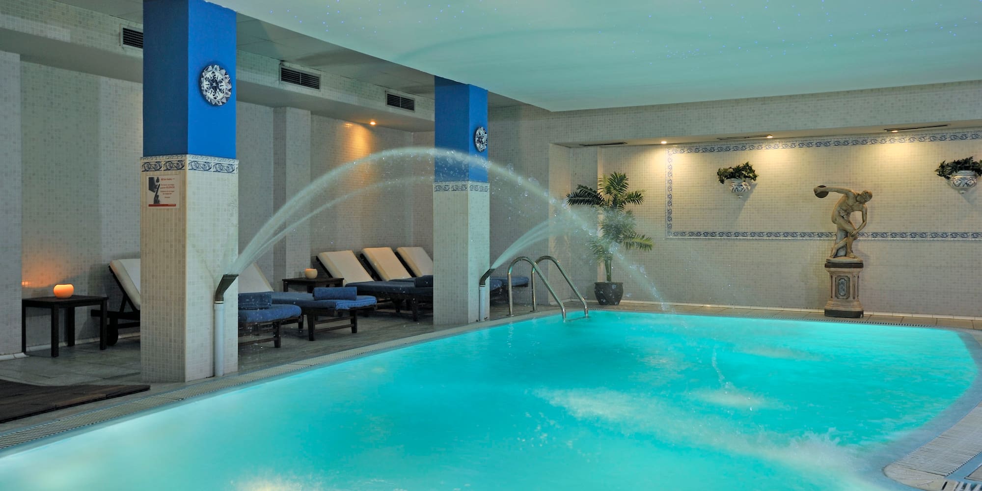 a swimming pool with water spraying into it