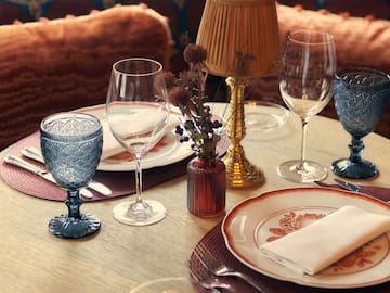 a table with plates and glasses