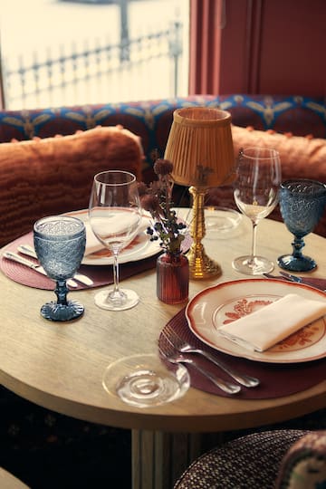 a table with plates and glasses