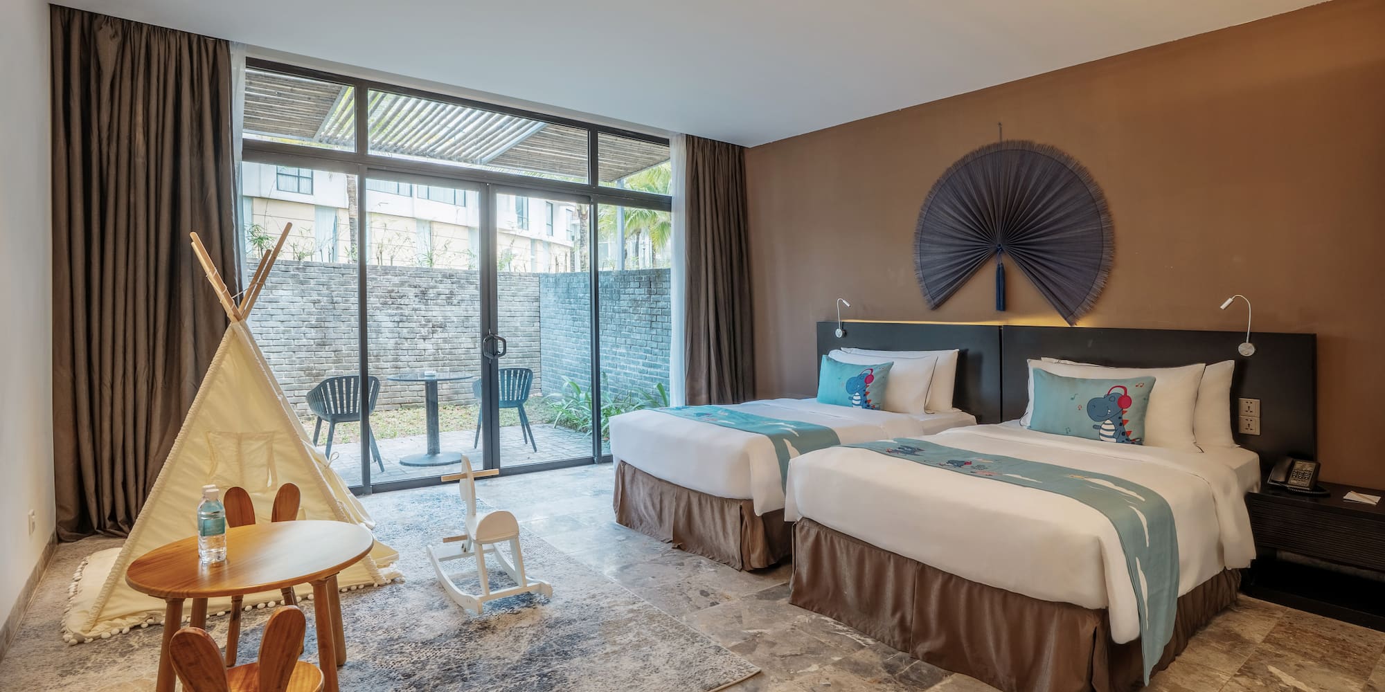 a room with two beds and a table