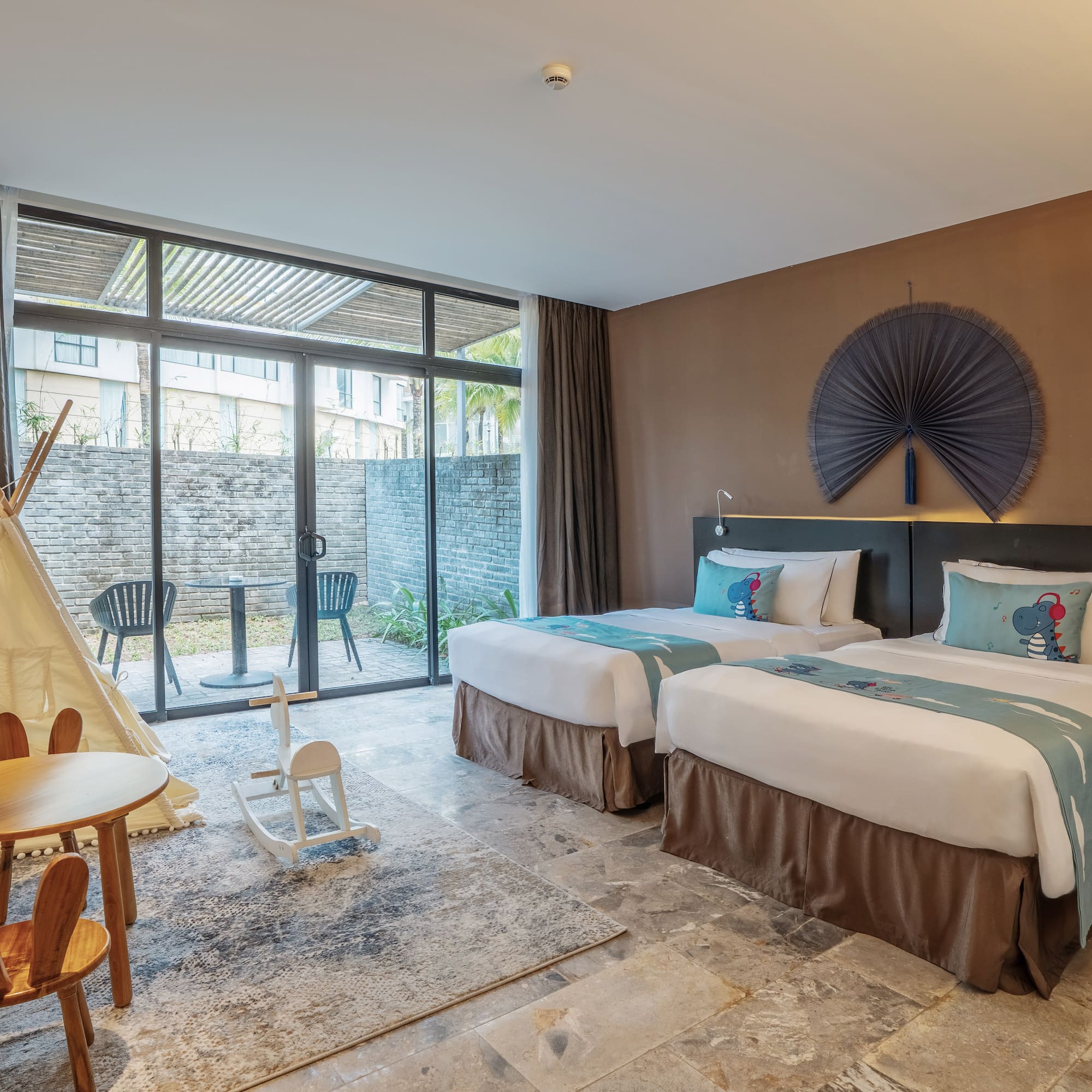 a room with two beds and a table